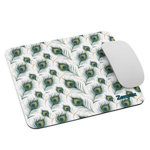 May include: A white mouse mat with a peacock feather pattern. The mouse mat has a green, blue, and gold design. The text "Zempex" is printed in the bottom right corner.