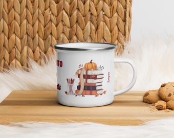 May include: White enamel mug with a silver rim and handle. The mug features a fall-themed design with a stack of books, a pumpkin, and pencils in a jar. The text "Read" is partially visible on the mug.