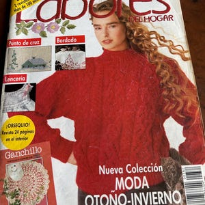 May include: A vintage October 1989 issue of Labores del Hogar magazine featuring a person wearing a red cable-knit sweater on the cover. The cover includes text such as Nueva Colección MODA OTOÑO-INVIERNO, Punto de cruz, Bordado, and Lencería.