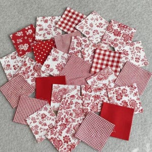 May include: A selection of red and white fabric squares, featuring diverse patterns such as floral, polka dot, and gingham. The squares are arranged in a scattered, overlapping design, creating a visually appealing arrangement.