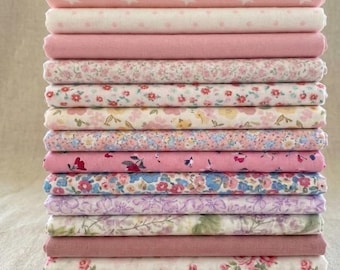 12-pack of pink floral printed cotton fabric scraps for patchwork and sewing. Pre-cut 25 cm (10") squares,random
