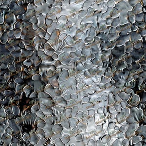 May include: A close-up of a textured, metallic surface with a pattern of irregular, interconnected shapes. The surface has a reflective quality, with variations in light and shadow. The text "KBC DIGITAL DEN" is repeated across the image.