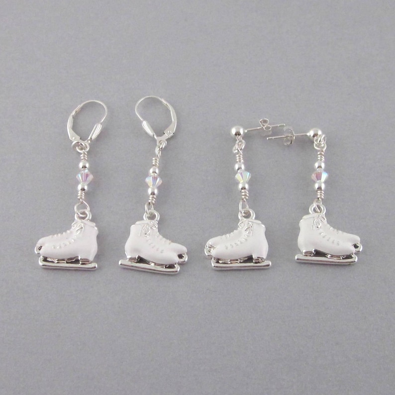 White enamel and sterling silver ice skate earrings.  Choose the lever back or post and clutch earrings. Charms measure 17 mm wide and 16 mm tall. Lever backs dangle 2 1/8 inches, post and clutch dangle 1 5/8". Both are measured from the top of the earring lever backs or posts. A thoughtful gift for the ice skater.