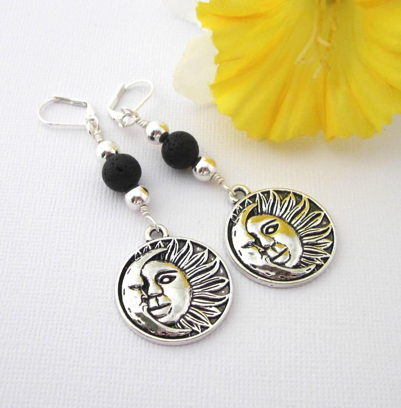 Bold sun and moon earrings have 25mm by 28mm textured, disk shape charms dangling below 8mm black lava stones and 6mm silver beads. Silver plated lever backs. Earrings dangle 3 inches long. Organza pouch included.