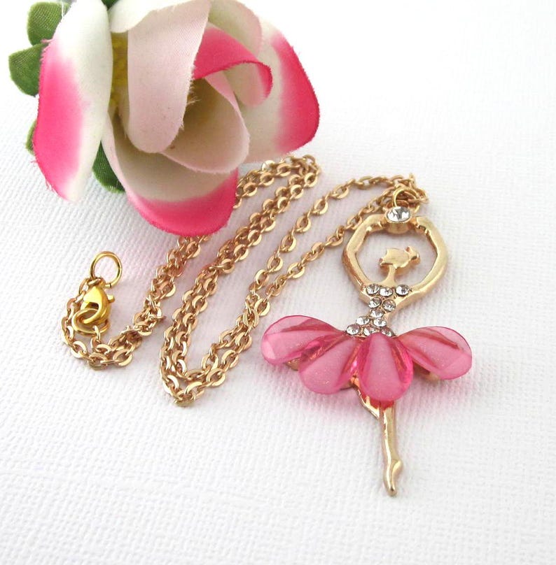 Gold and pink large ballerina pendant with rhinestones. Choose chain length from 16 to 19 inches. Pendant 2 1/4 inches by 1 3/8  inches. Gift box included.
