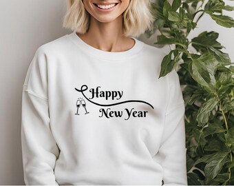 May include: White sweatshirt with the text "Happy New Year" in a black script font. Two champagne glasses are to the left of the text. The sweatshirt is a festive apparel item for celebrating the new year.