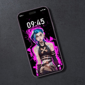 May include: A pink smartphone with a black screen displaying the time 09:45. The screen also features a digital illustration of a blue-haired woman with a pink and black background.