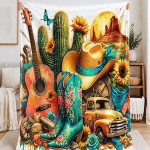 May include: A fleece blanket featuring a vibrant western-themed print with a guitar, turquoise floral cowboy boots, a yellow cowboy hat, a vintage yellow truck, sunflowers, cacti, a butterfly, and a desert landscape with a large sun.