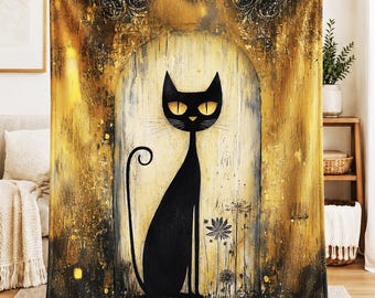 May include: A rectangular throw blanket featuring a stylized black cat with large yellow eyes centered within an arched doorway. The background displays a textured, distressed aesthetic in shades of deep black and metallic gold with floral motifs.