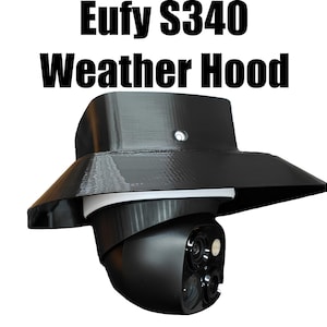 May include: A black Eufy S340 Weather Hood, designed to protect a security camera. The hood has a wide, angled brim and a cylindrical base. The text "Eufy S340 Weather Hood" is displayed in bold, black letters.