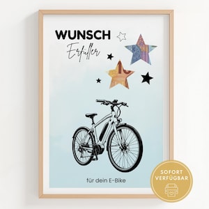 以下が含まれることがあります： 電動自転車の白黒イラストが描かれた額入りプリント。ドイツ語のテキスト、星、テキスト入りの金色の円が含まれています。背景は水色と白のグラデーションです。