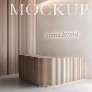 May include: A wooden reception desk with a curved front and vertical slats. The desk is in front of a wall with a light brown color and the text "aroma.brand" in white.