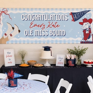 May include: A graduation party scene with a banner reading "Congratulations Emery Kate OLE MISS BOUND." Decorations include balloons, a cake, and a sign that says "Class of 2024."