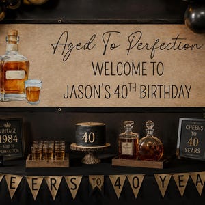 May include: Aged to Perfection birthday party decorations. Includes a banner, cake, whiskey bottles, and balloons. The sign says "Welcome to Jason's 40th Birthday". There is also a sign that says "Cheers to 40 Years".