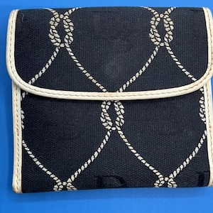 A Vintage Black and White Dooney & Bourke Small Snap Wallet
