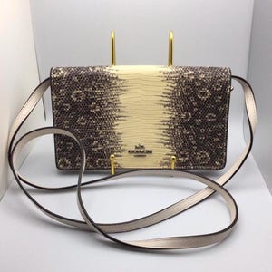 A Coach fold over Hayden Clutch/Crossbody Handbag