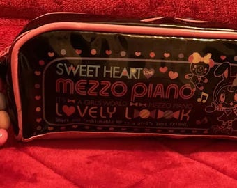 Une très belle pochette vintage rare pour cosmétiques Mezzo Piano
