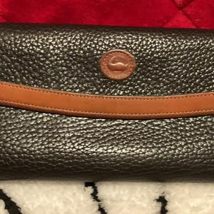 A Very Beautiful Black/Tan Leather Vintage Dooney & Bourke Clutch Wallet