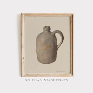 May include: A vintage illustration of a brown stoneware pitcher with a handle. The pitcher is depicted against a light beige background.