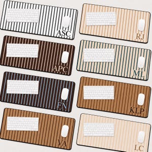 May include: Eight rectangular desk mats featuring vertical stripes in various color combinations. Each mat displays a white keyboard and a white computer mouse, with personalized initials printed in the bottom right corner including ASC, RJ, APC, ML, FN, KLP, VA, and LC.