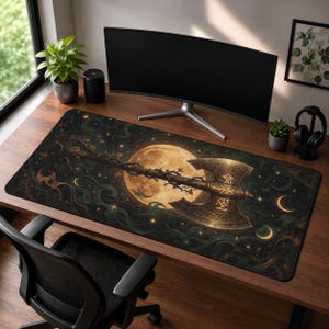May include: A rectangular desk mat featuring a dark, celestial-themed illustration of a large, ornate double-bladed axe with glowing runes on the blade, set against a backdrop of a full moon, swirling dark clouds, and scattered golden stars.