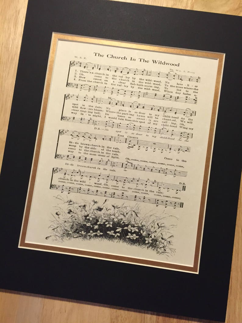 May include: A vintage sheet music print of the song "The Church In The Wildwood". The sheet music is printed in black ink on white paper and features a black and white illustration of a woodland scene with flowers.