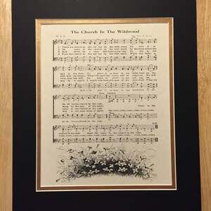 May include: A vintage sheet music page titled "The Church In The Wildwood". The sheet music features a black and white illustration of a church in a valley with trees and flowers. The lyrics are printed in black ink on a cream-colored background.