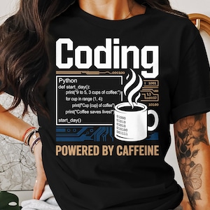 May include: Black t-shirt with the word "Coding" in white block letters. Below, a Python code snippet is displayed next to a steaming coffee cup. The phrase "POWERED BY CAFFEINE" is printed at the bottom.