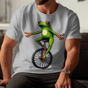 Funny Frog Riding Unicycle Graphic T-Shirt: Quirky Animal Tee