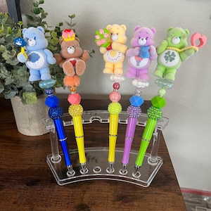 Canetas de miçangas Care Bear