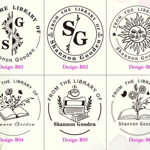May include: A collection of six circular black and white custom book stamp designs. Each design features the text 'FROM THE LIBRARY OF' and 'Shannon Gooden' alongside various illustrations including sunflowers, initials, a sun and moon, and books.
