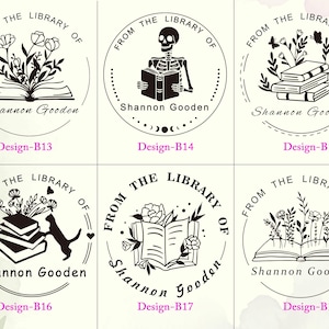 May include: Six circular black and white rubber stamp designs labeled Design-B13 through Design-B18. Each features the text FROM THE LIBRARY OF and Shannon Gooden, with illustrations including open books, flowers, a skeleton, stacks of books, and a cat.