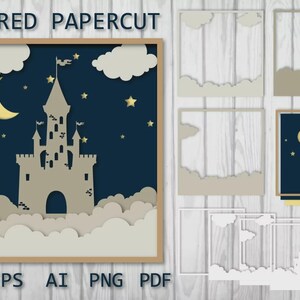 May include: A layered papercut design featuring a castle silhouette against a dark blue night sky with a crescent moon, stars, and clouds. The design is framed in a light brown border. The text "LAYERED PAPERCUT" is at the top.