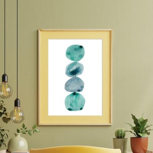 Modern abstract artwork of stacked pebbles in shades of blue and green. Original hand-drawn artwork using watercolour. Wall art for home
