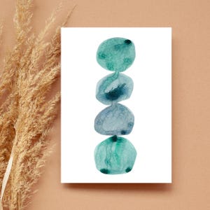 Modern abstract artwork of stacked pebbles in shades of blue and green. Original hand-drawn artwork using watercolour. Wall art for home