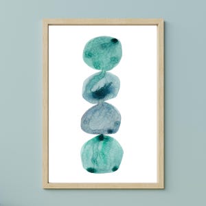 Modern abstract artwork of stacked pebbles in shades of blue and green. Original hand-drawn artwork using watercolour. Wall art for home