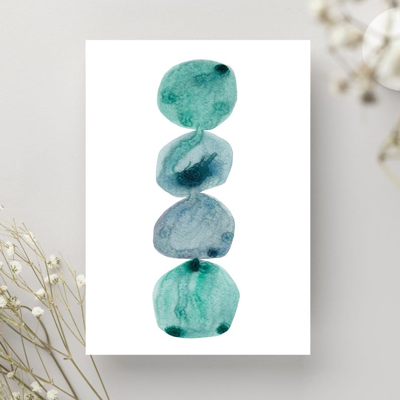 Modern abstract artwork of stacked pebbles in shades of blue and green. Original hand-drawn artwork using watercolour. Wall art for home