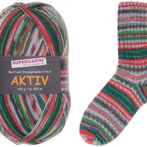 May include: A ball of Aktiv yarn and a matching knitted sock. The yarn is a mix of red, green, white, and gray. The sock has horizontal stripes and patterned sections, with the text "SUPERGARNE AKTIV" on the yarn label.