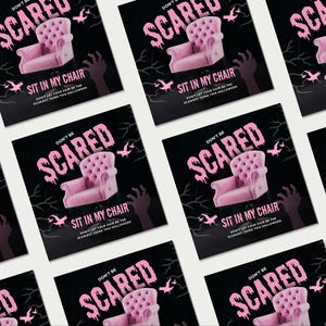 May include: A repeating pattern of square Halloween cards. Each card displays a pink tufted chair, the words "DON'T BE SCARED," and "SIT IN MY CHAIR" in pink on a black background. Silhouettes of hands, bats, and branches complete the design.