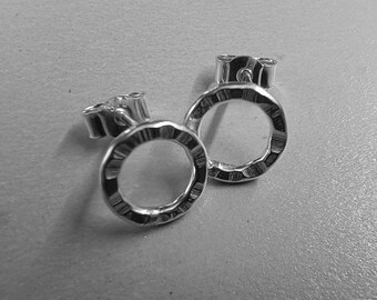 Circular silver stud earrings