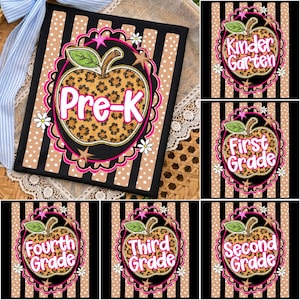 May include: A rectangular sign featuring a leopard print apple graphic with the text Pre-K, Kindergarten, First Grade, Second Grade, Third Grade, and Fourth Grade. The design includes black and tan stripes, white polka dots, and small white flowers.