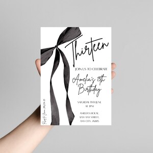May include: A white invitation card with a black watercolor bow and the word "Thirteen" in elegant script. The card announces Amelia's 13th birthday celebration, including the date, time, and location.