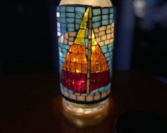 Lighted stained glass mosaic sailboat bottle