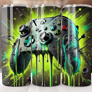 Puede incluir: Un mando de juego verde, negro y blanco con pintura verde goteando sobre un fondo negro y verde. El mando es un accesorio de juego popular.