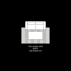 May include: Top-down view of a two-seater sofa, a rectangular coffee table, and a striped rug. The sofa is white, the table is rectangular, and the rug has vertical stripes. The text below reads: Two seater sofa 5x8 ft 152.4x243 cm.