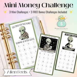 May include: A white binder with gold detailing contains three money-saving challenge cards. Each card features an alien graphic with phrases such as "Too Tired For This Planet" and "I'm Not Crazy." The cards have numbered circles for tracking savings.