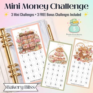 May include: A Mini Money Challenge savings tracker set featuring three rectangular cards with bakery-themed illustrations and numbered circles. One card is inside a gold-ringed binder, while two others sit alongside, all labeled Bakery Bliss.