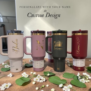 Personalized Stanley 40oz tumbler with handle and flip straw lid featuring custom name and design laser engraved on insulated stainless steel cup, perfect gift for her or him, reusable travel drinkware for hot and cold beverages with durable finish and stylish look, custom engraved tumbler ideal for birthdays, holidays and special personalized gifting