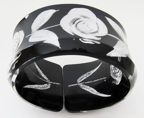 A  Reversed  Carved  Oval Lucite  Bracelet with Black with White Rose/Leaves.