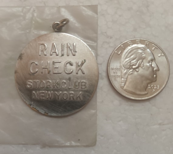 Vintage NYC Stork club night club rain check token pendant chrome metal has pitting USA made